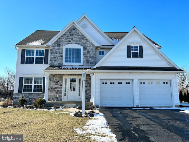 view of front facade with a garage and a front yard