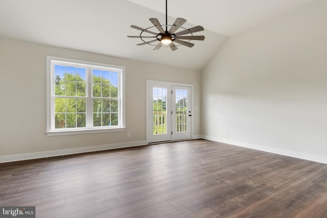 empty room with vaulted ceiling, ceiling fan, and dark hardwood / wood-style floors