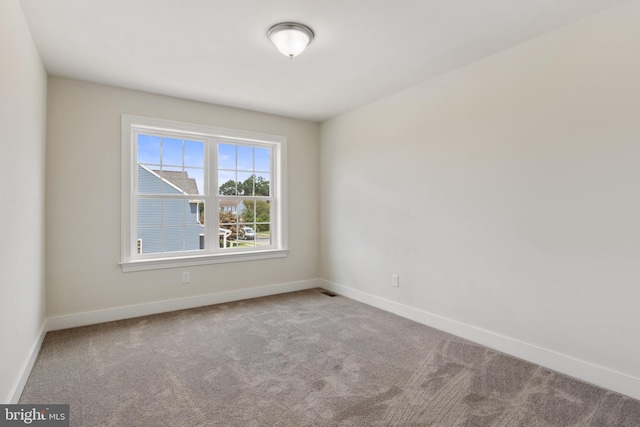 unfurnished room featuring carpet flooring