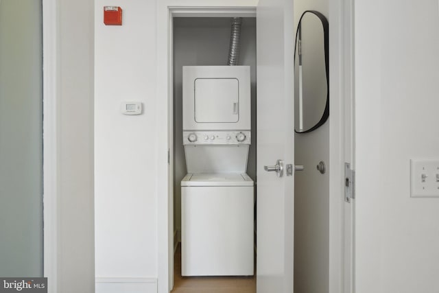 washroom with stacked washer and clothes dryer