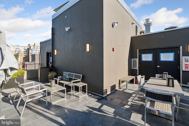 rear view of property featuring a patio