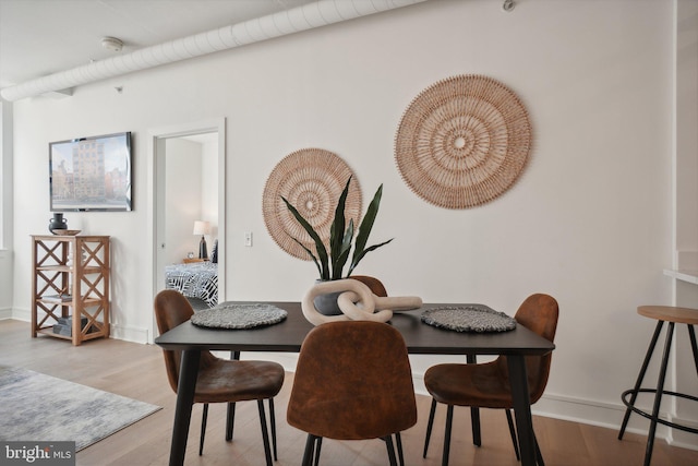 dining room with light hardwood / wood-style floors