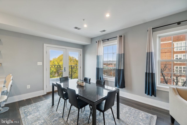 dining area featuring french doors and dark hardwood / wood-style flooring