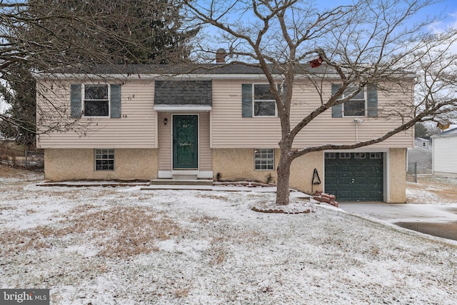 bi-level home featuring a garage