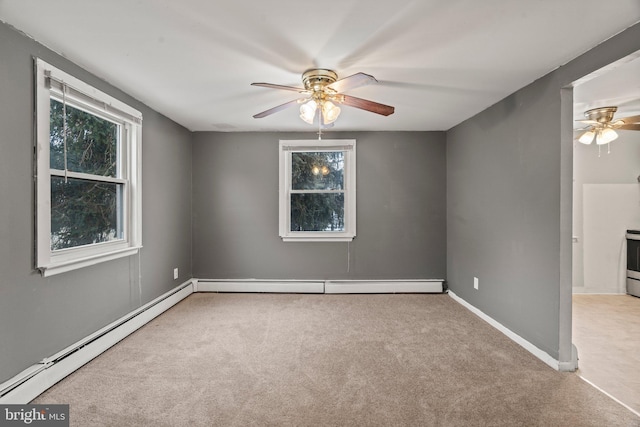 carpeted empty room with ceiling fan and a baseboard radiator