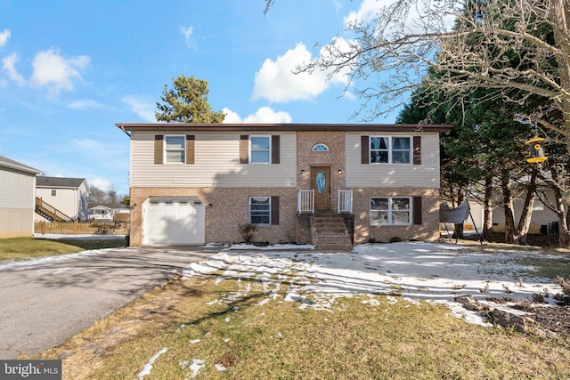 bi-level home featuring a garage