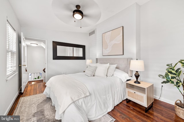 bedroom featuring ceiling fan and dark hardwood / wood-style floors