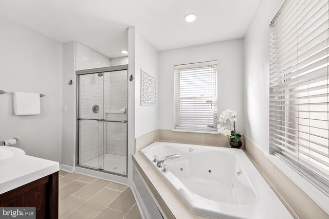 bathroom featuring vanity, separate shower and tub, and tile patterned flooring