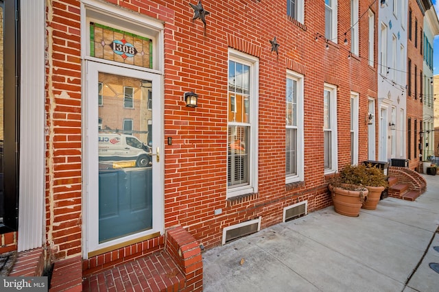 doorway to property with a patio