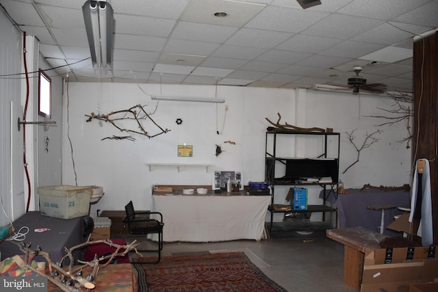 basement featuring a paneled ceiling