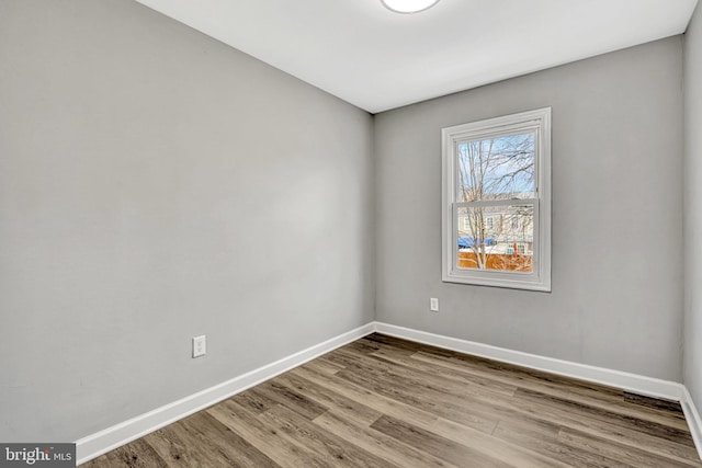 spare room featuring light hardwood / wood-style flooring