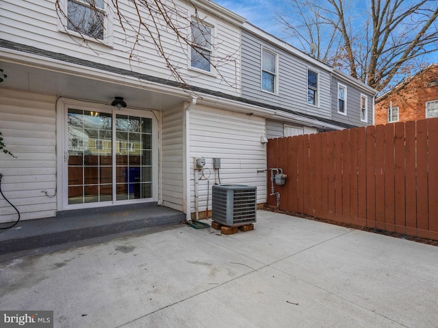 exterior space with a patio area and central AC