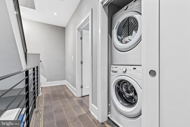 washroom featuring stacked washing maching and dryer