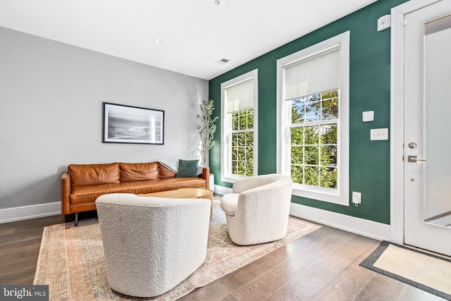 living room with dark hardwood / wood-style floors