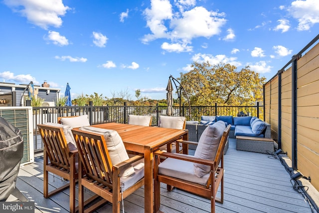 wooden terrace with outdoor lounge area