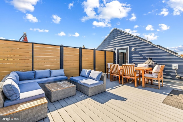 wooden terrace featuring an outdoor hangout area