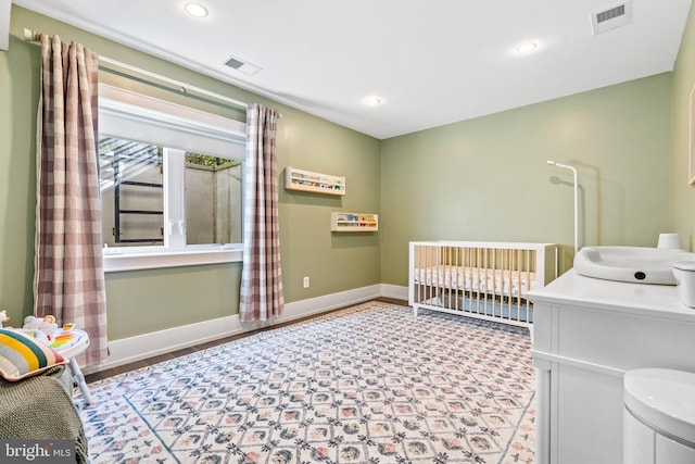 bedroom with a nursery area