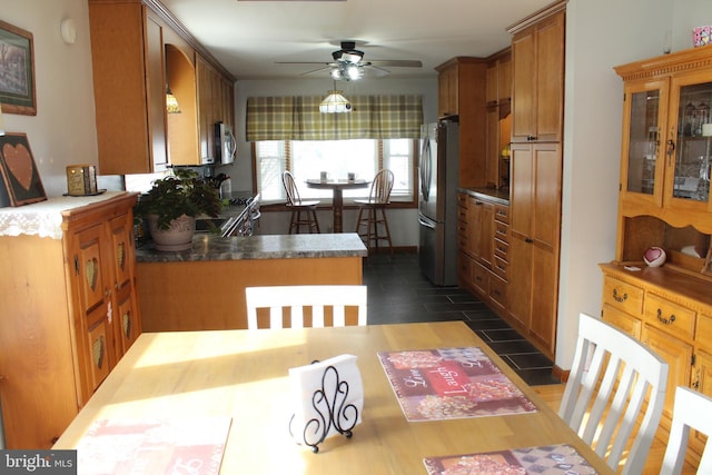 kitchen featuring ceiling fan and appliances with stainless steel finishes