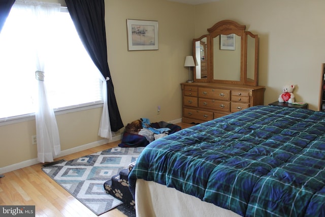 bedroom with light wood-type flooring