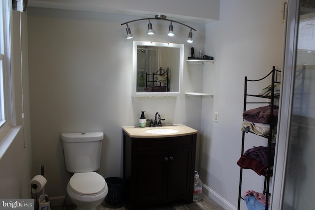 bathroom with toilet and vanity