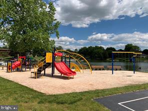 view of playground with a water view