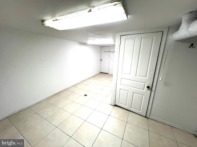 basement featuring light tile patterned floors