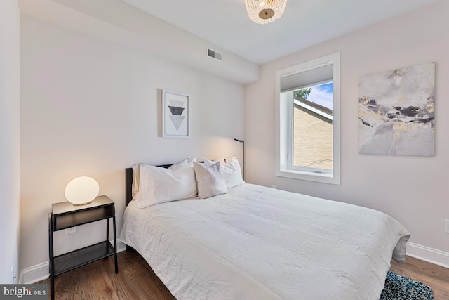 bedroom featuring wood-type flooring