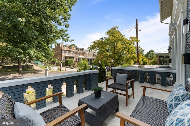 view of patio featuring an outdoor living space and a hot tub