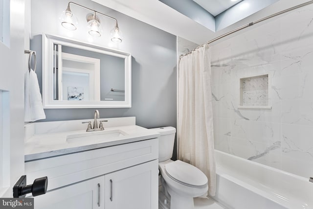 full bathroom with vanity, shower / tub combo, and toilet