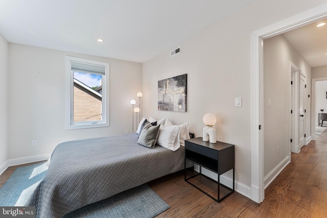 bedroom featuring wood-type flooring