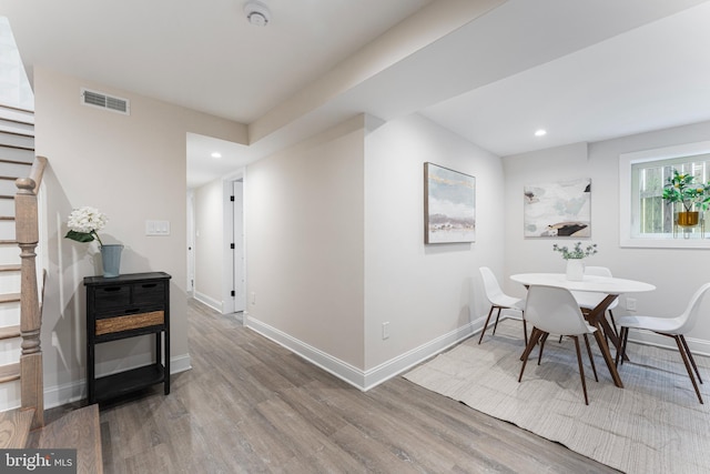 dining area with hardwood / wood-style flooring