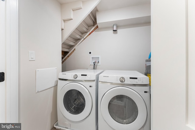 laundry area featuring washing machine and clothes dryer