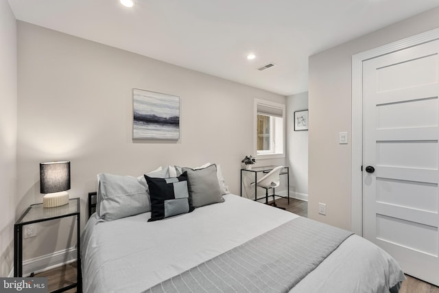 bedroom featuring hardwood / wood-style flooring