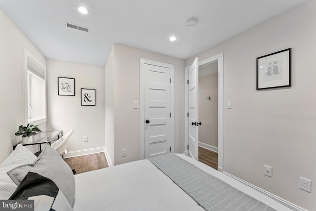 bedroom with hardwood / wood-style flooring