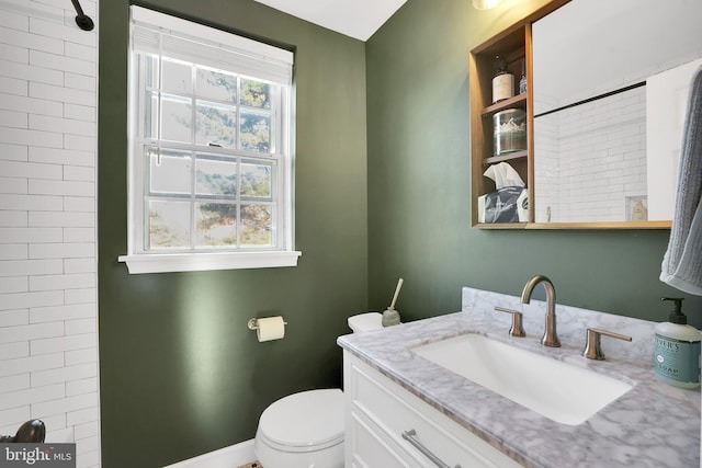 bathroom featuring toilet and vanity