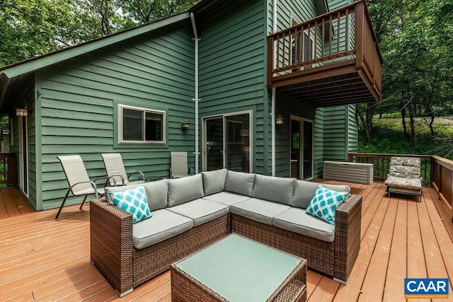 deck featuring outdoor lounge area