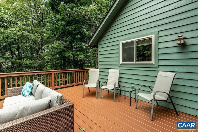 wooden deck with outdoor lounge area