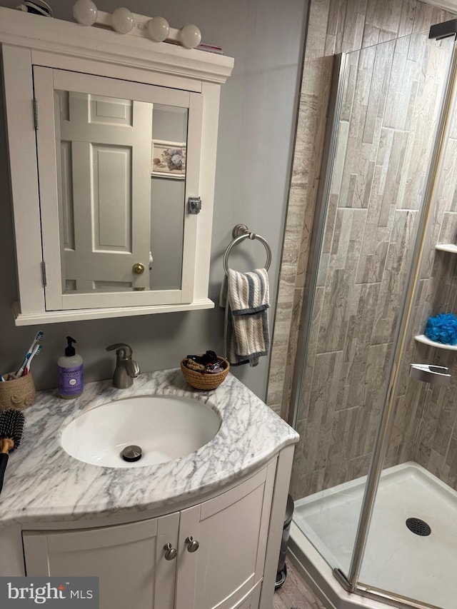 bathroom with vanity and an enclosed shower