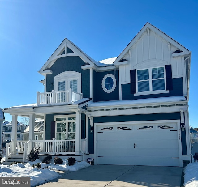 view of front of property with a porch and a garage