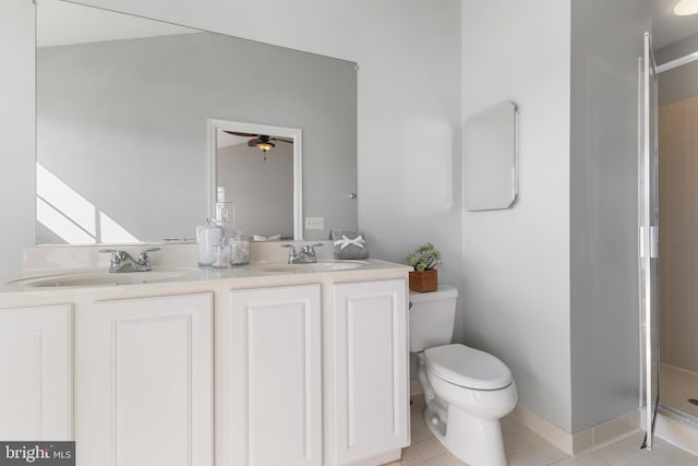 full bathroom with a sink, toilet, tile patterned floors, and a tile shower