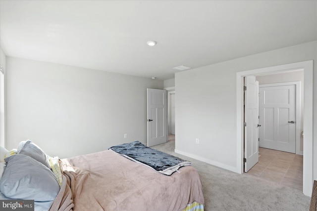 bedroom with light colored carpet