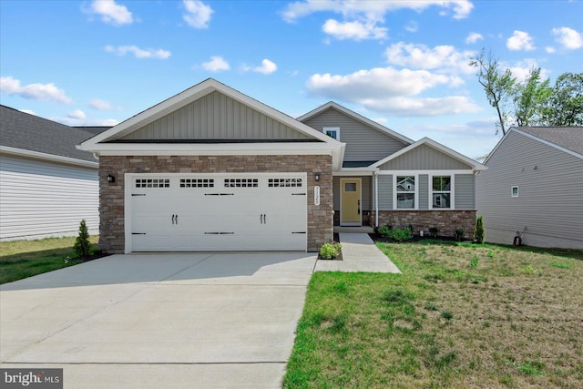 craftsman-style house featuring a front yard and a garage