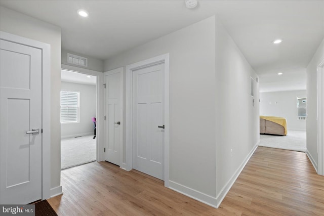 hallway with light wood-type flooring