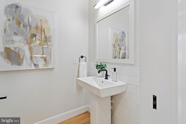 bathroom with hardwood / wood-style flooring