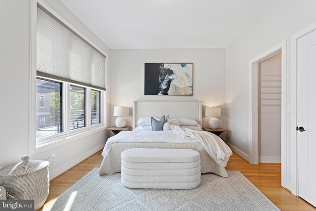 bedroom with light wood-type flooring