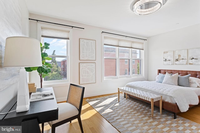 bedroom with light hardwood / wood-style flooring