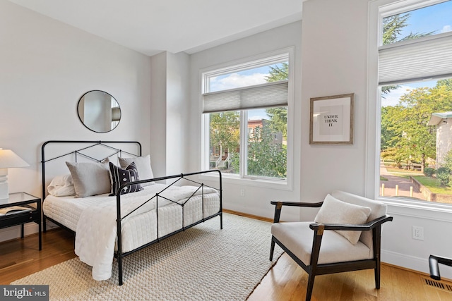 bedroom with light hardwood / wood-style floors