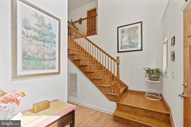 stairway featuring hardwood / wood-style floors