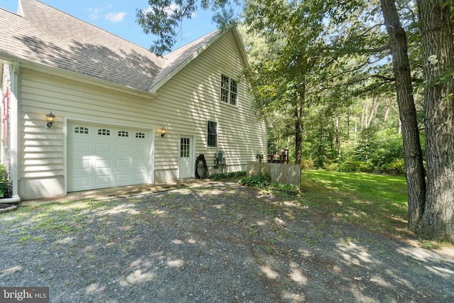 view of side of home with a garage