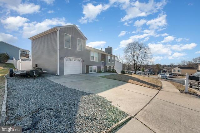 view of side of property with a garage